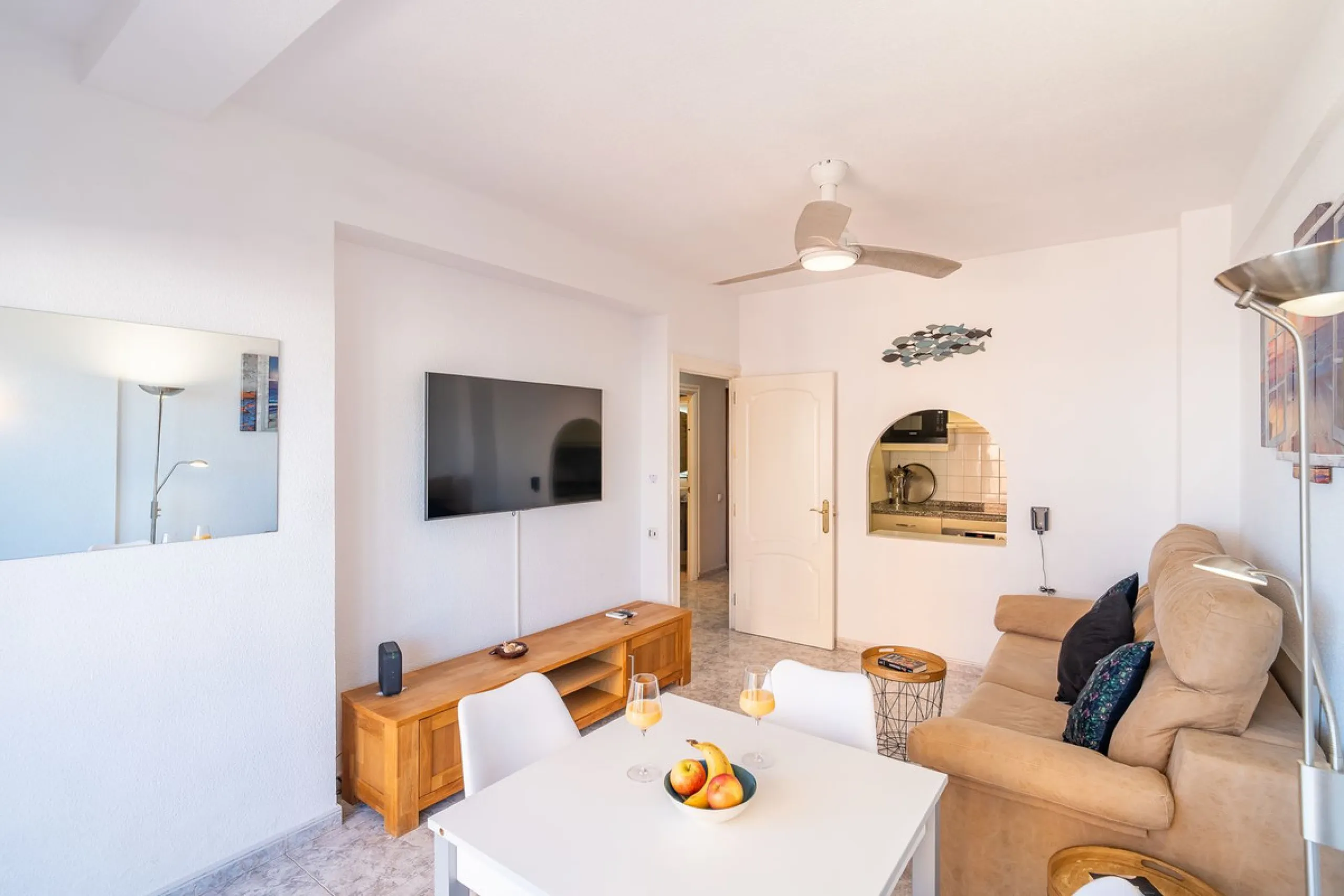 Discover this pristine, fully furnished 1-bedroom apartment in the iconic Edificio Perla 5, ideally positioned frontline beach in the very heart of Fuengirola, Málaga. Priced at €322,500, this residence offers spectacular beach and city views, combining M