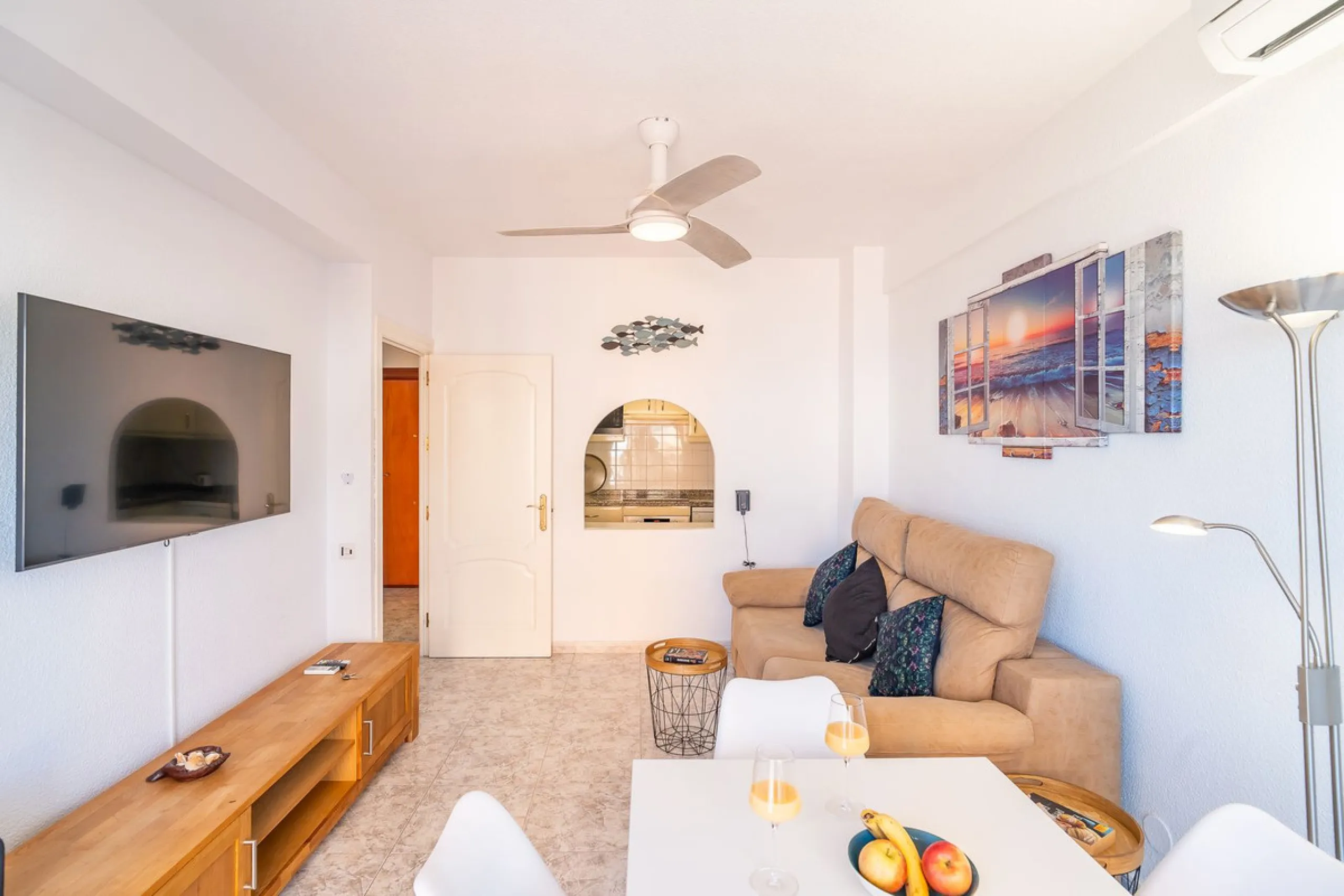 Discover this pristine, fully furnished 1-bedroom apartment in the iconic Edificio Perla 5, ideally positioned frontline beach in the very heart of Fuengirola, Málaga. Priced at €322,500, this residence offers spectacular beach and city views, combining M