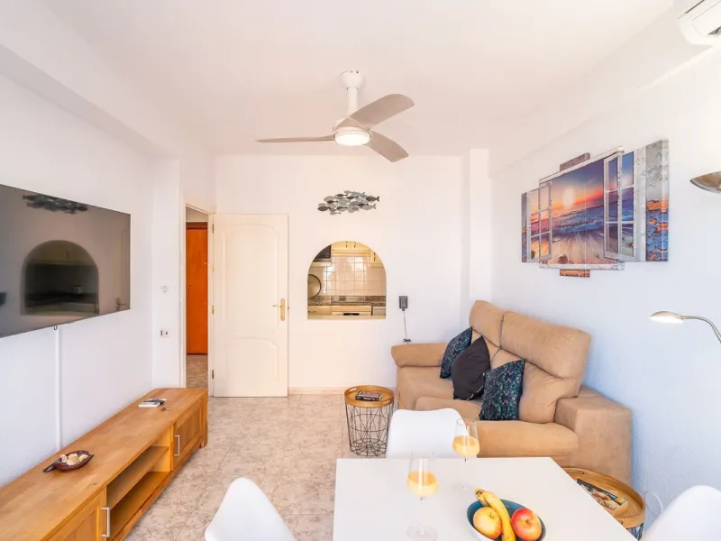 Discover this pristine, fully furnished 1-bedroom apartment in the iconic Edificio Perla 5, ideally positioned frontline beach in the very heart of Fuengirola, Málaga. Priced at €322,500, this residence offers spectacular beach and city views, combining M