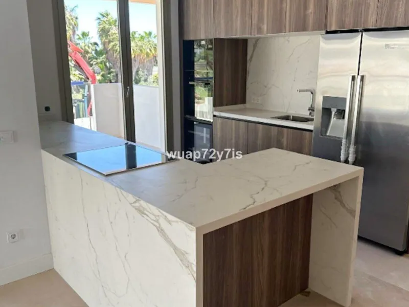 Set within Benalus, one of the most exclusive gated communities on Marbella's prestigious Golden Mile, this exceptional brand-new two-bedroom residence represents the essence of contemporary Mediterranean luxury. Located just moments from the beach and di