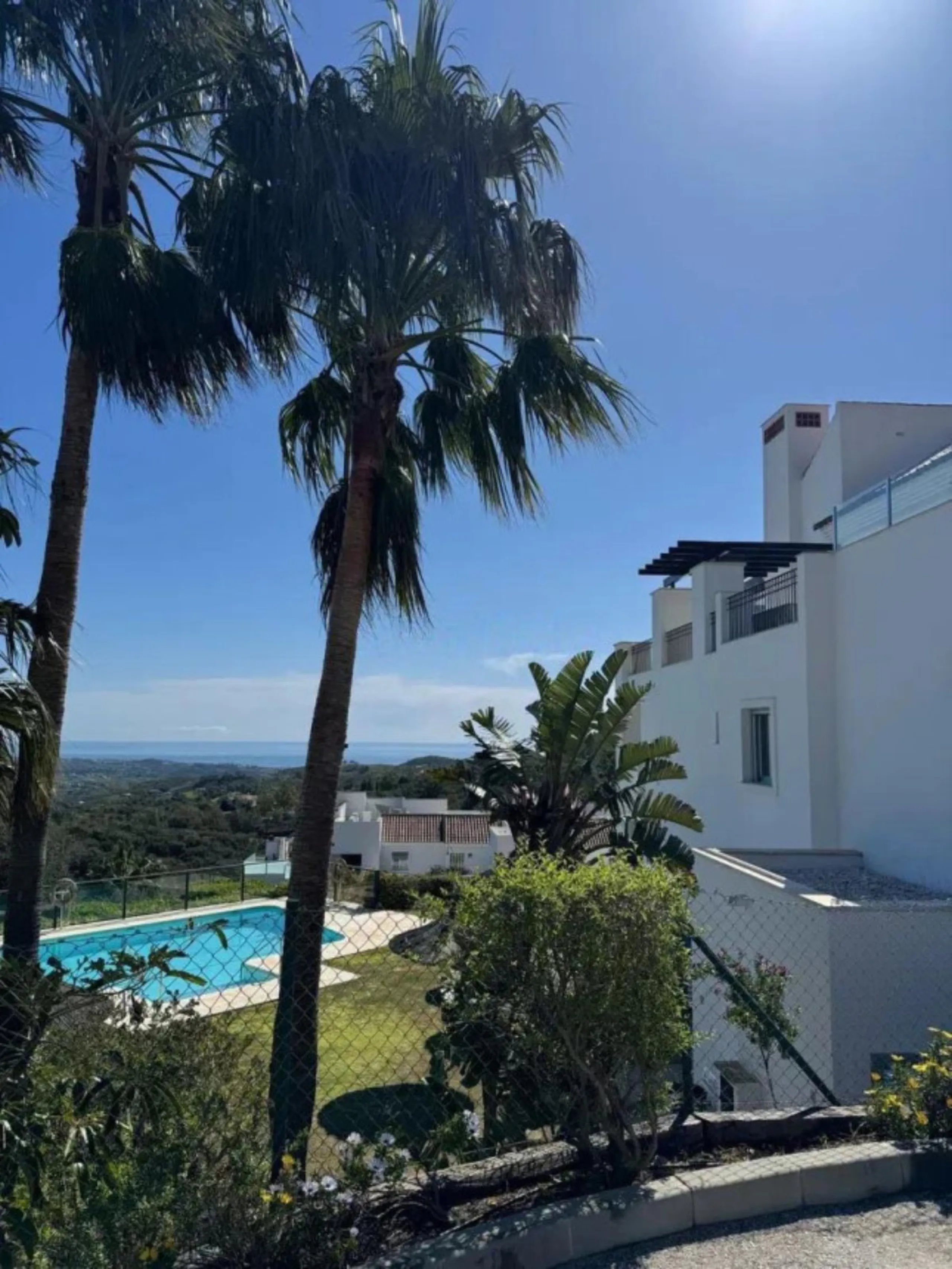 Stunning corner first-floor apartment with superb sea and mountain views, located in the protected area of La Mairena (UNESCO Biosphere Reserve) on the hills above Elviria.