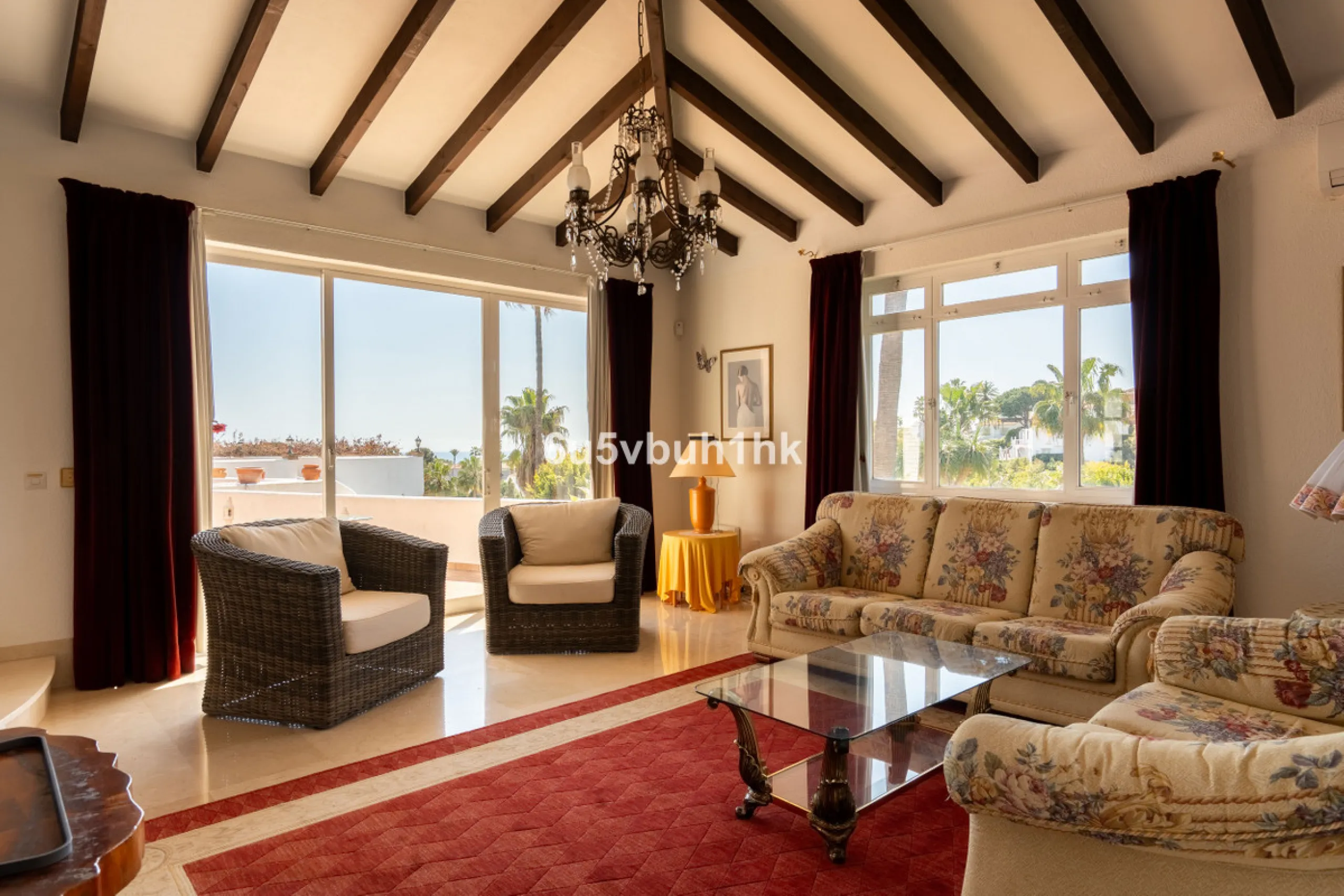 Hidden among palm trees and mature gardens in the established residential area of Sitio de Calahonda, this beautiful Andalusian villa captures the essence of traditional Mediterranean living. From the moment you arrive through the private gated entrance a