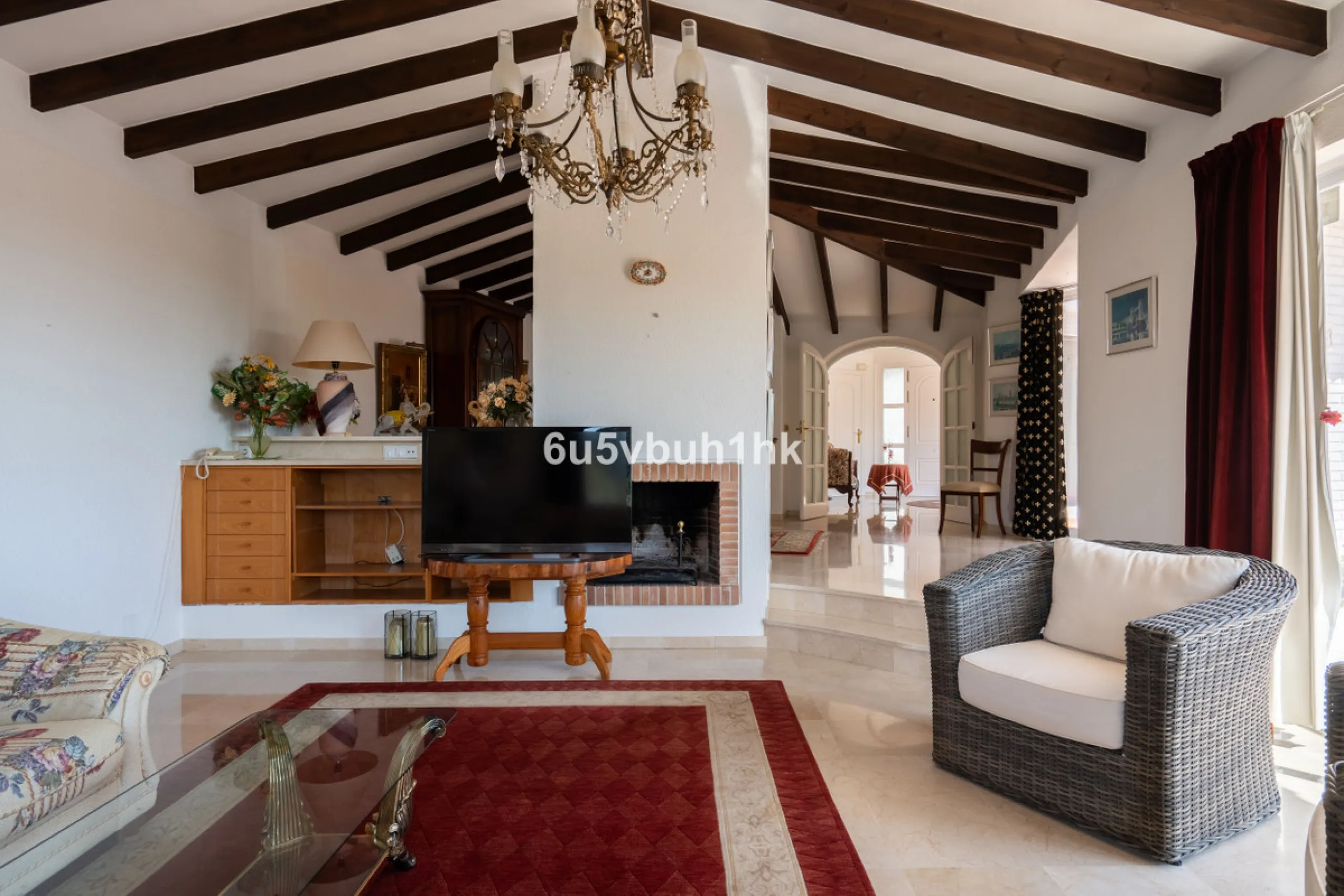 Hidden among palm trees and mature gardens in the established residential area of Sitio de Calahonda, this beautiful Andalusian villa captures the essence of traditional Mediterranean living. From the moment you arrive through the private gated entrance a