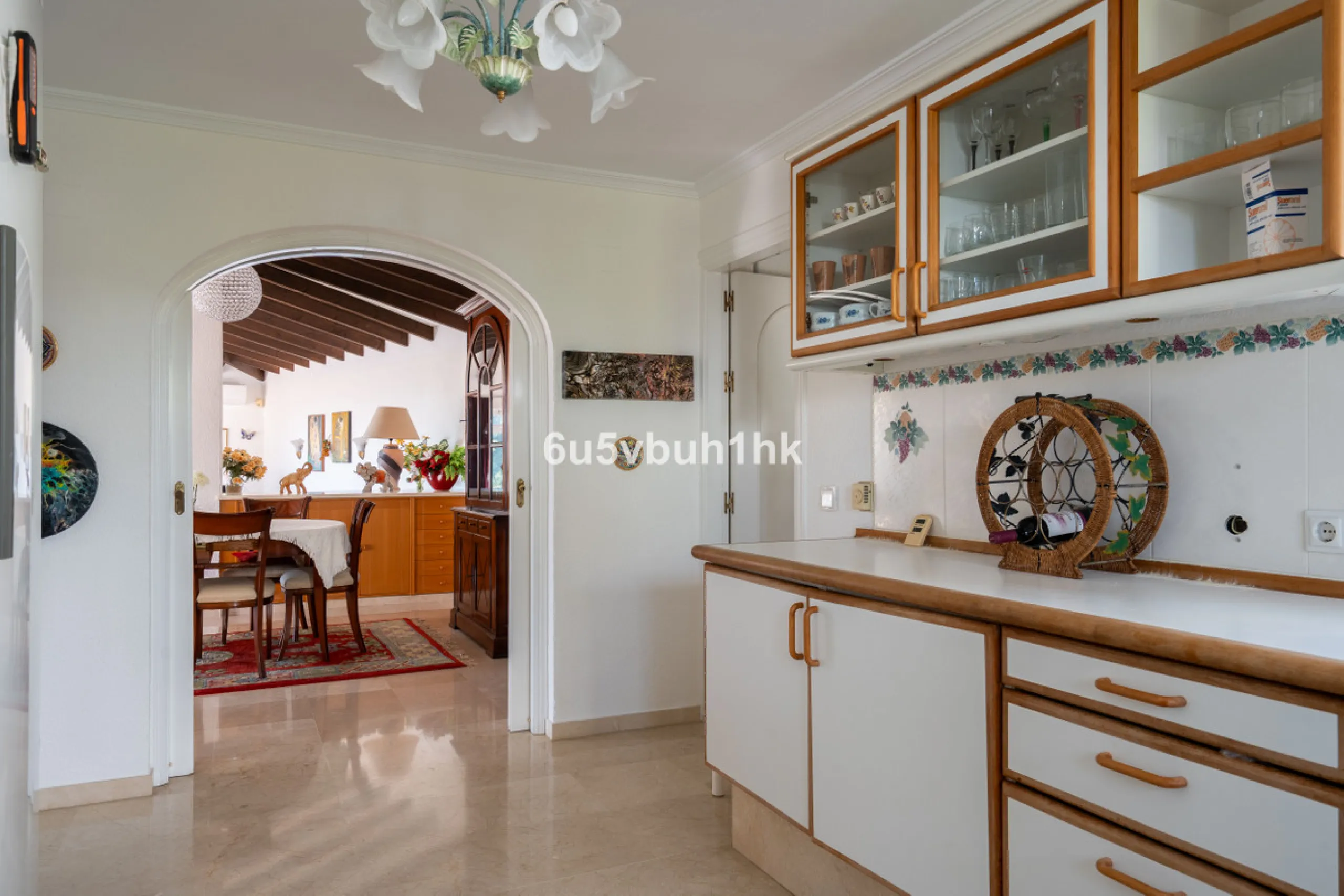 Hidden among palm trees and mature gardens in the established residential area of Sitio de Calahonda, this beautiful Andalusian villa captures the essence of traditional Mediterranean living. From the moment you arrive through the private gated entrance a