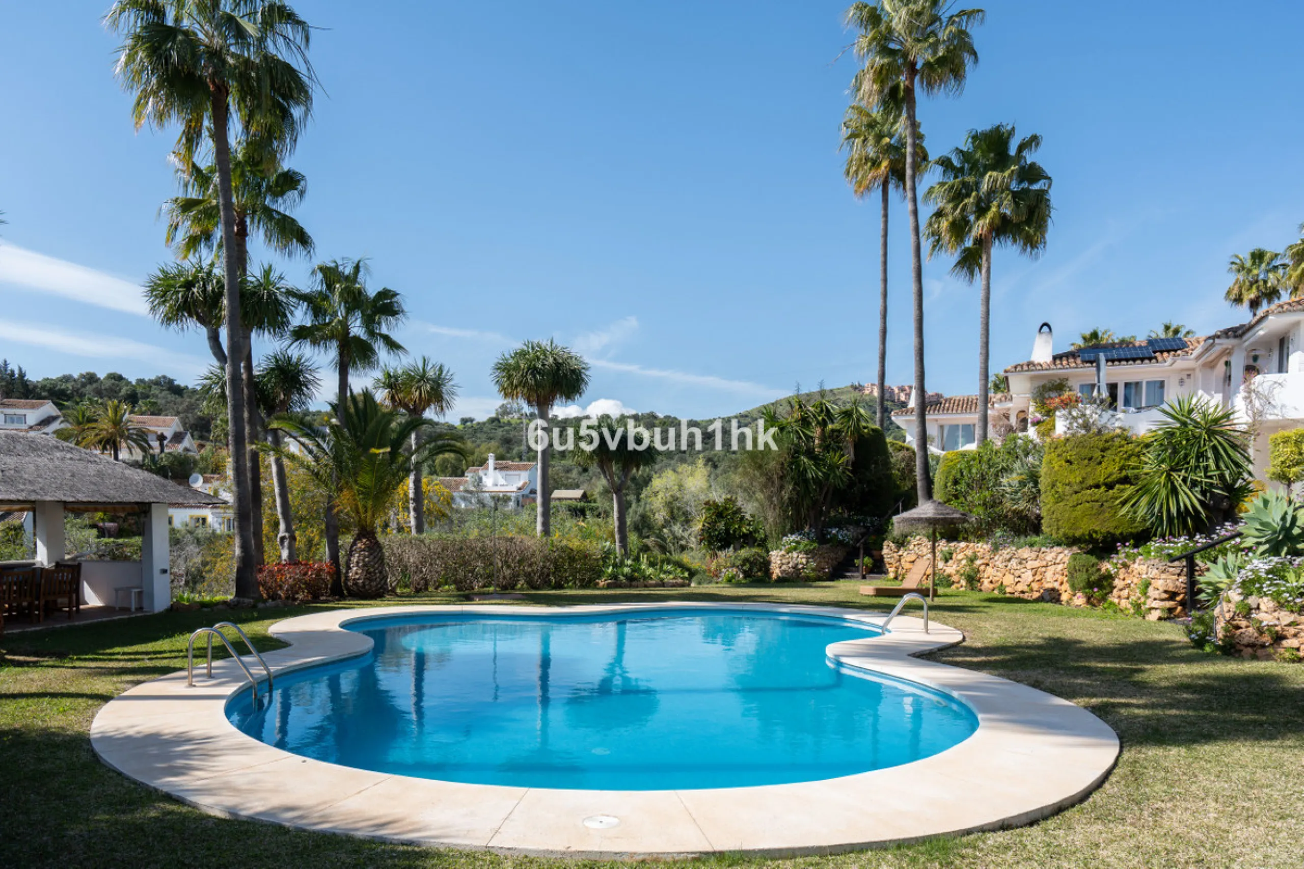 Hidden among palm trees and mature gardens in the established residential area of Sitio de Calahonda, this beautiful Andalusian villa captures the essence of traditional Mediterranean living. From the moment you arrive through the private gated entrance a