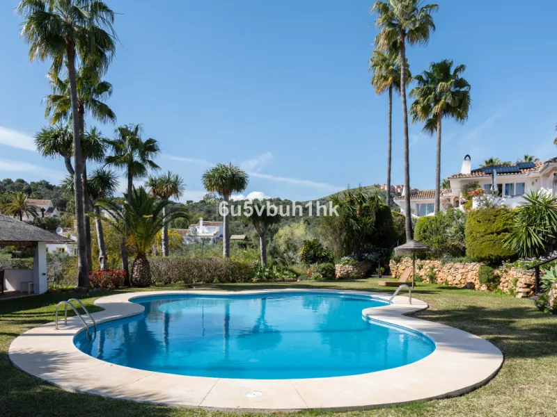 Hidden among palm trees and mature gardens in the established residential area of Sitio de Calahonda, this beautiful Andalusian villa captures the essence of traditional Mediterranean living. From the moment you arrive through the private gated entrance a