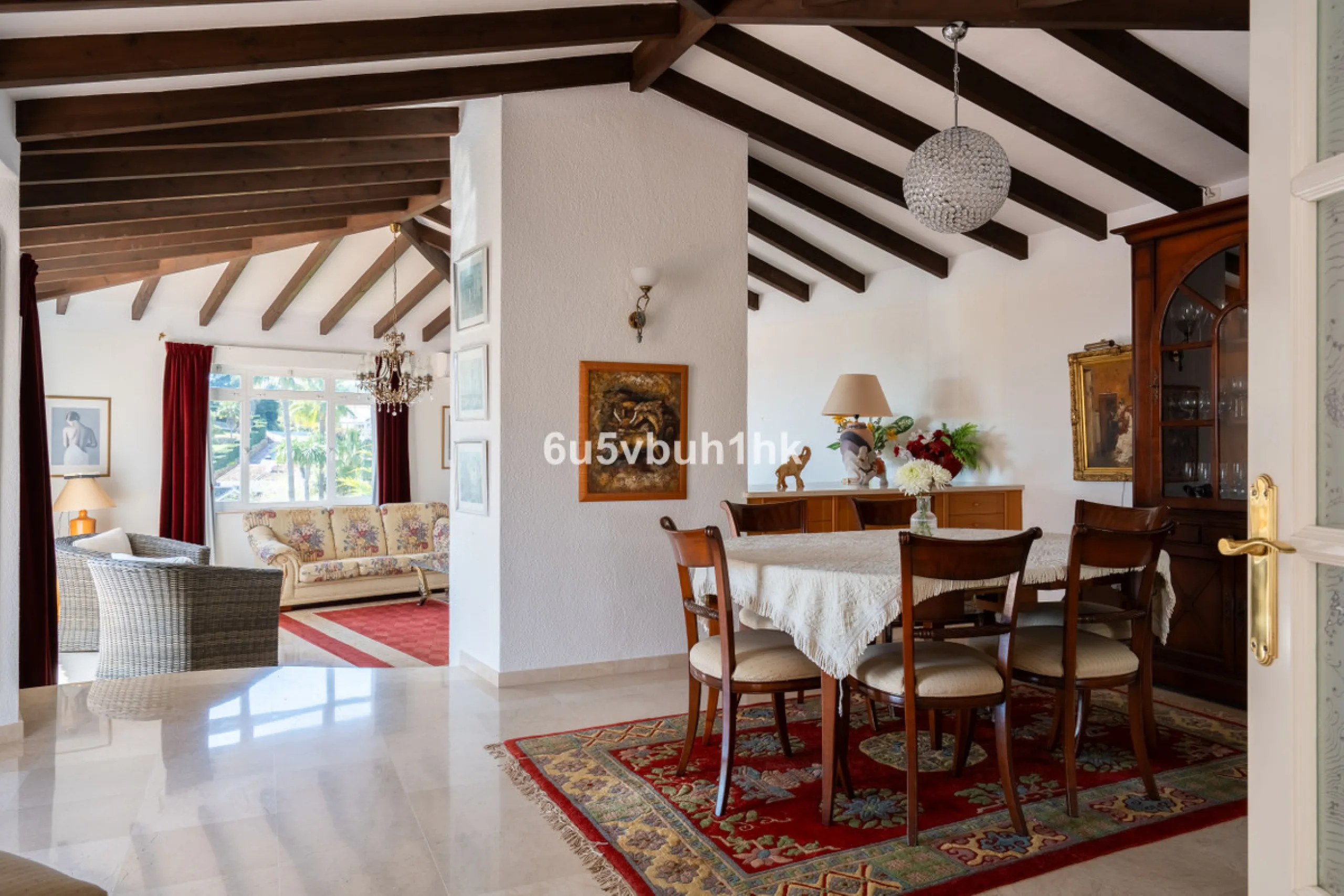Hidden among palm trees and mature gardens in the established residential area of Sitio de Calahonda, this beautiful Andalusian villa captures the essence of traditional Mediterranean living. From the moment you arrive through the private gated entrance a