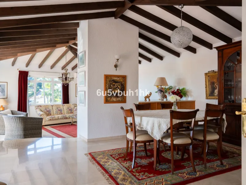 Hidden among palm trees and mature gardens in the established residential area of Sitio de Calahonda, this beautiful Andalusian villa captures the essence of traditional Mediterranean living. From the moment you arrive through the private gated entrance a
