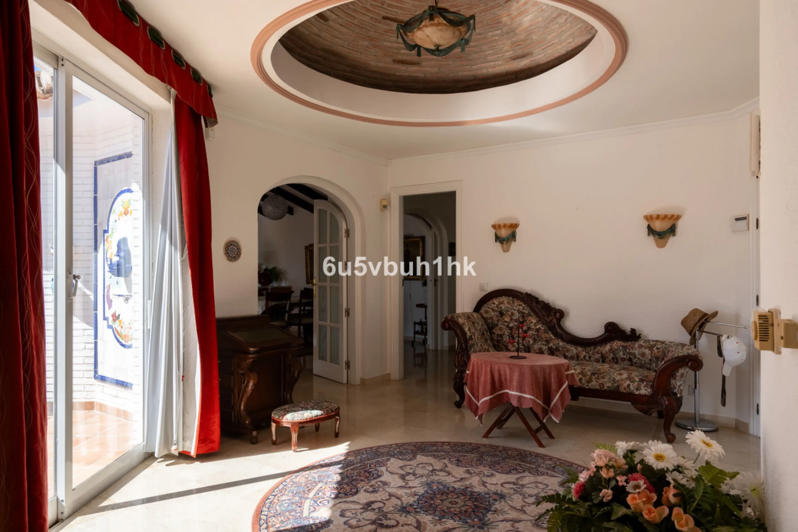 Hidden among palm trees and mature gardens in the established residential area of Sitio de Calahonda, this beautiful Andalusian villa captures the essence of traditional Mediterranean living. From the moment you arrive through the private gated entrance a