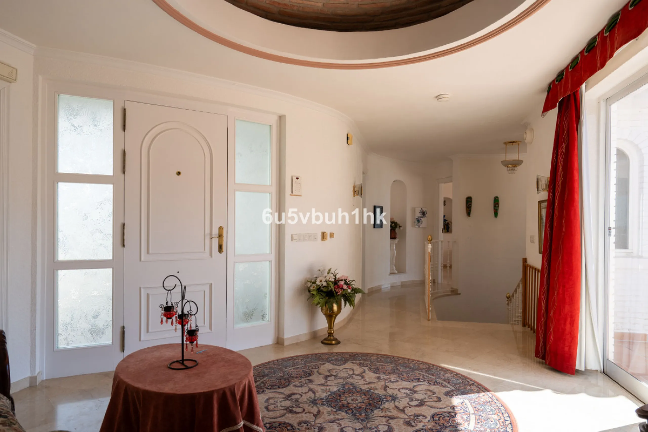 Hidden among palm trees and mature gardens in the established residential area of Sitio de Calahonda, this beautiful Andalusian villa captures the essence of traditional Mediterranean living. From the moment you arrive through the private gated entrance a