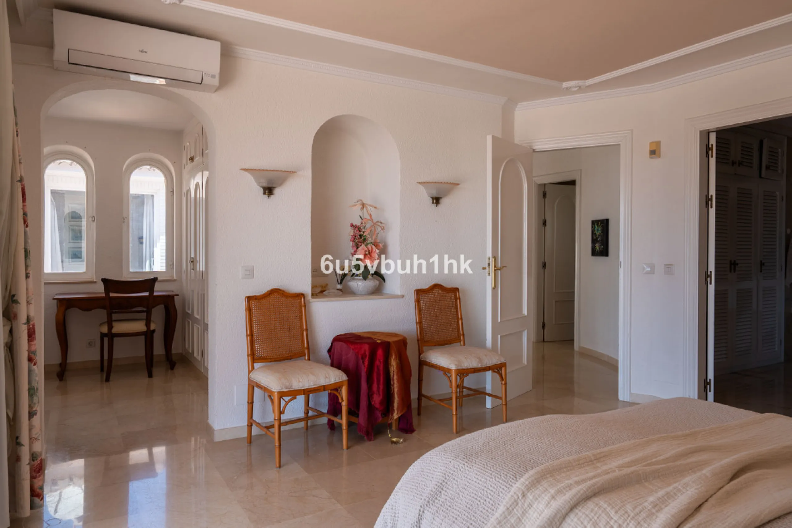 Hidden among palm trees and mature gardens in the established residential area of Sitio de Calahonda, this beautiful Andalusian villa captures the essence of traditional Mediterranean living. From the moment you arrive through the private gated entrance a
