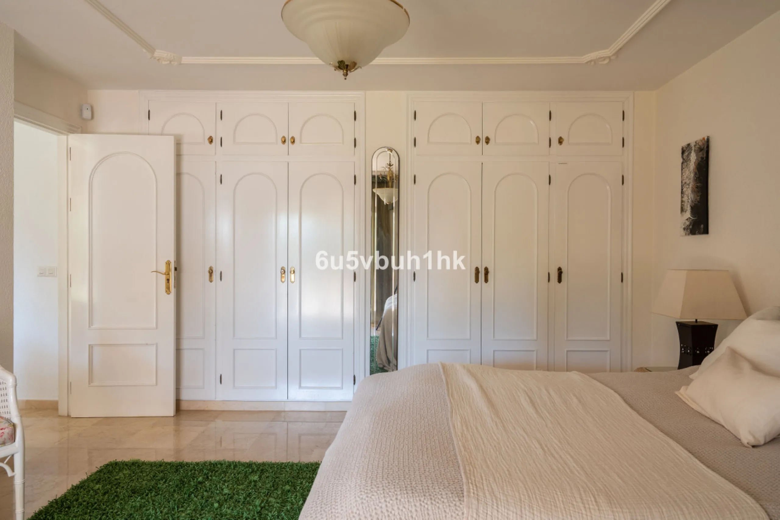 Hidden among palm trees and mature gardens in the established residential area of Sitio de Calahonda, this beautiful Andalusian villa captures the essence of traditional Mediterranean living. From the moment you arrive through the private gated entrance a