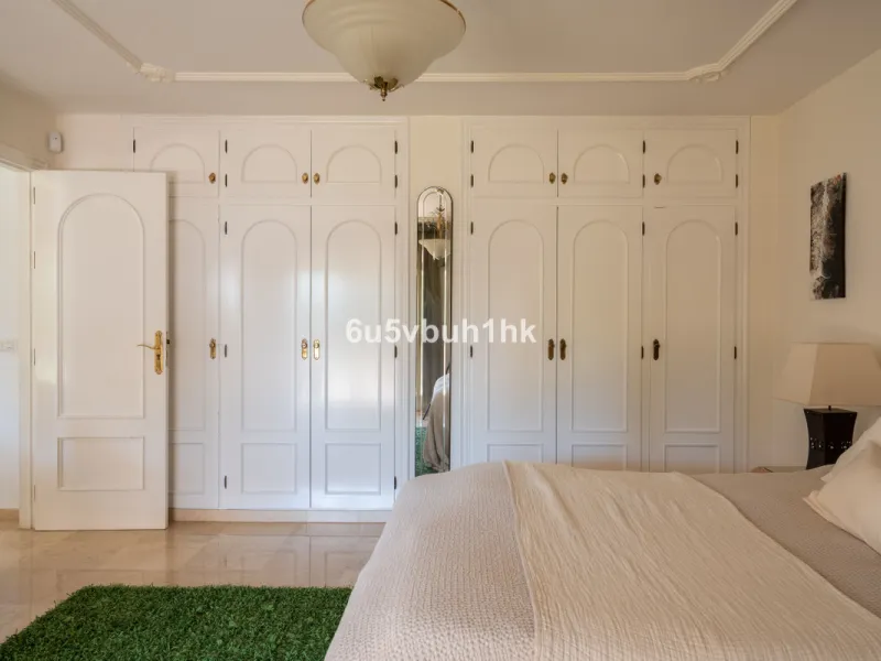 Hidden among palm trees and mature gardens in the established residential area of Sitio de Calahonda, this beautiful Andalusian villa captures the essence of traditional Mediterranean living. From the moment you arrive through the private gated entrance a