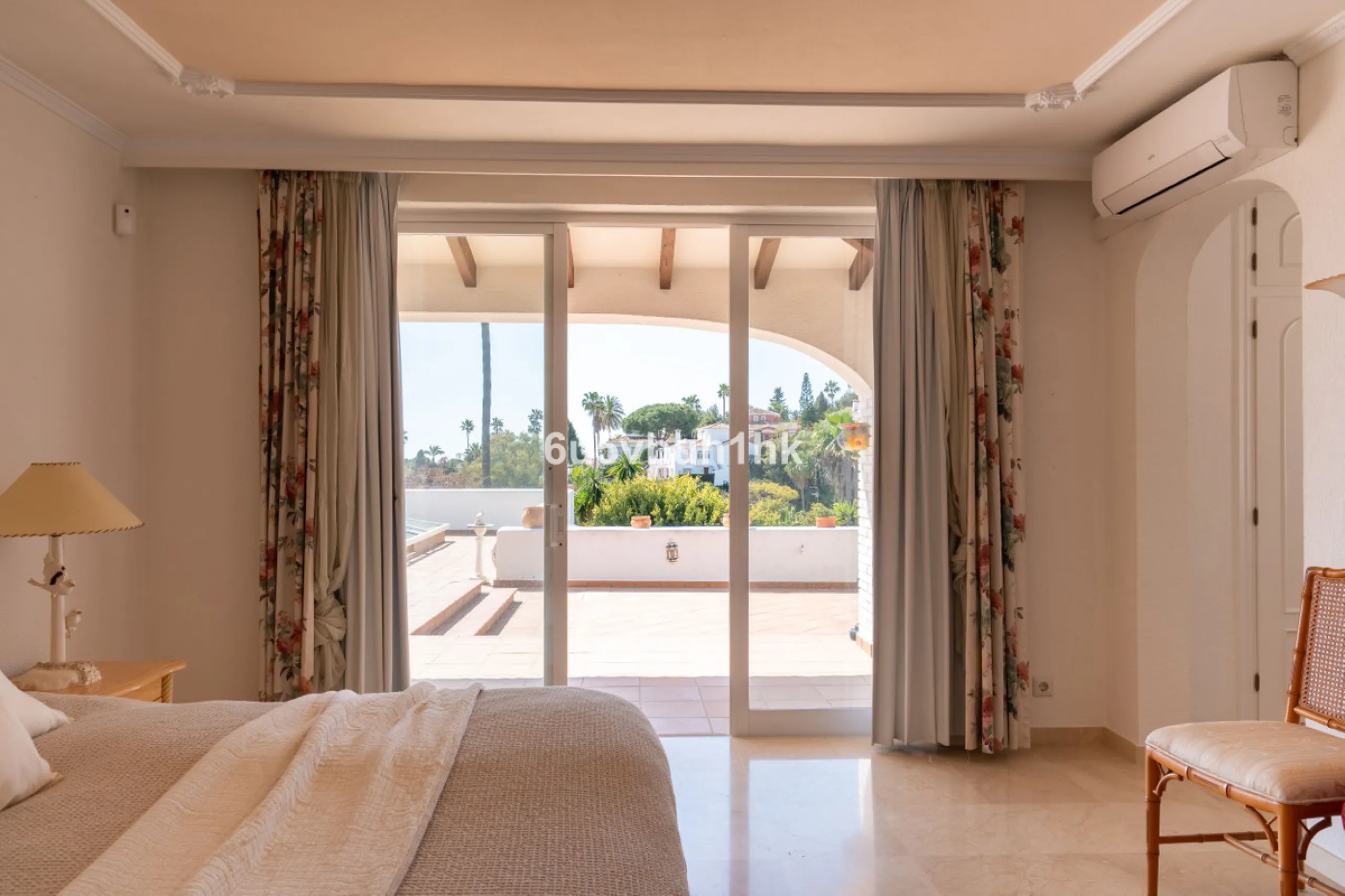 Hidden among palm trees and mature gardens in the established residential area of Sitio de Calahonda, this beautiful Andalusian villa captures the essence of traditional Mediterranean living. From the moment you arrive through the private gated entrance a