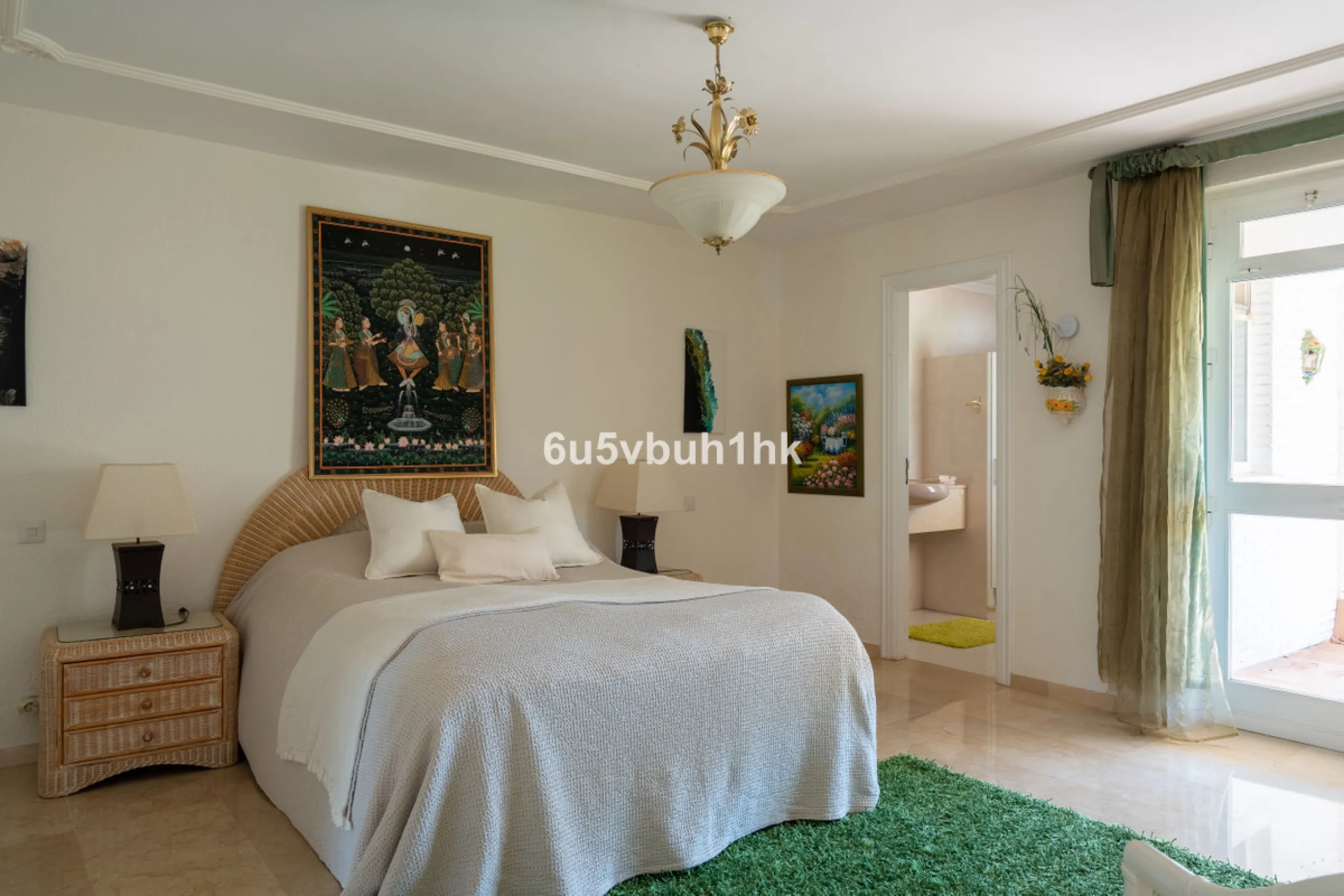 Hidden among palm trees and mature gardens in the established residential area of Sitio de Calahonda, this beautiful Andalusian villa captures the essence of traditional Mediterranean living. From the moment you arrive through the private gated entrance a