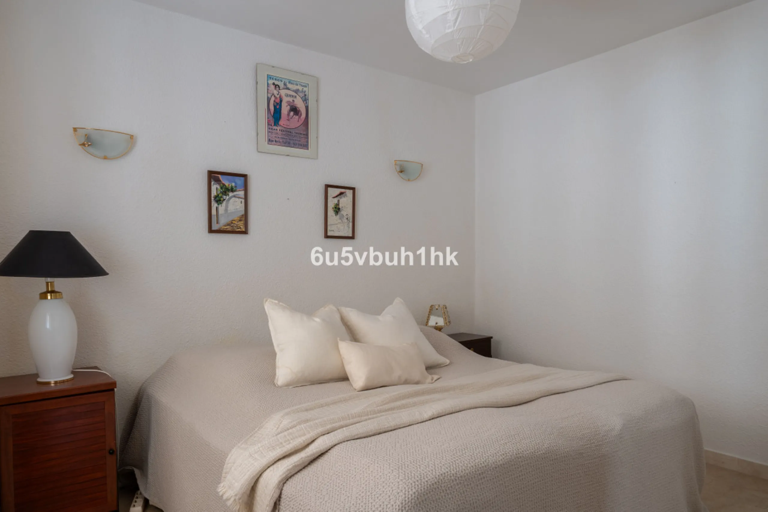 Hidden among palm trees and mature gardens in the established residential area of Sitio de Calahonda, this beautiful Andalusian villa captures the essence of traditional Mediterranean living. From the moment you arrive through the private gated entrance a