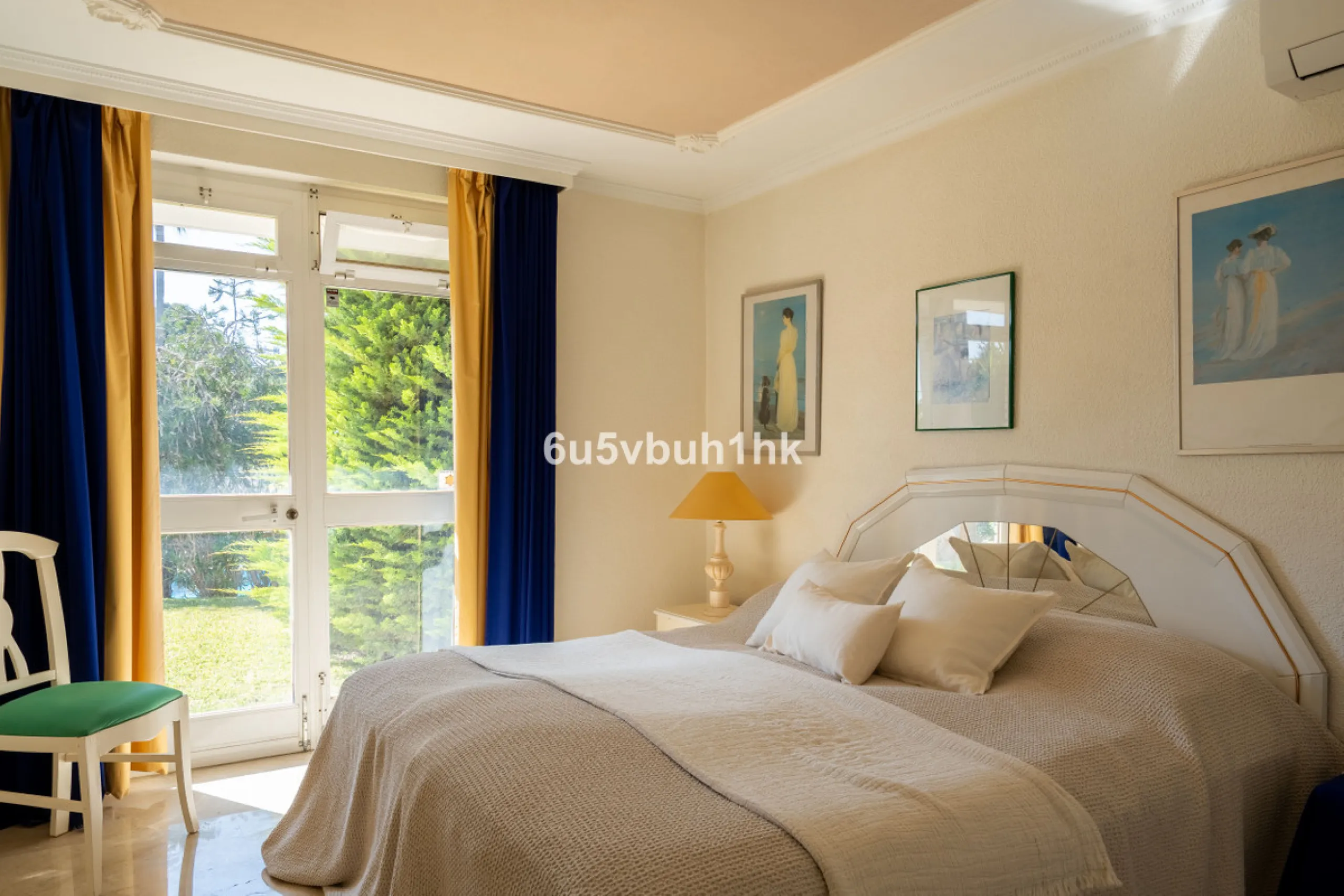 Hidden among palm trees and mature gardens in the established residential area of Sitio de Calahonda, this beautiful Andalusian villa captures the essence of traditional Mediterranean living. From the moment you arrive through the private gated entrance a