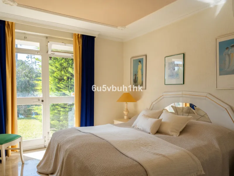 Hidden among palm trees and mature gardens in the established residential area of Sitio de Calahonda, this beautiful Andalusian villa captures the essence of traditional Mediterranean living. From the moment you arrive through the private gated entrance a