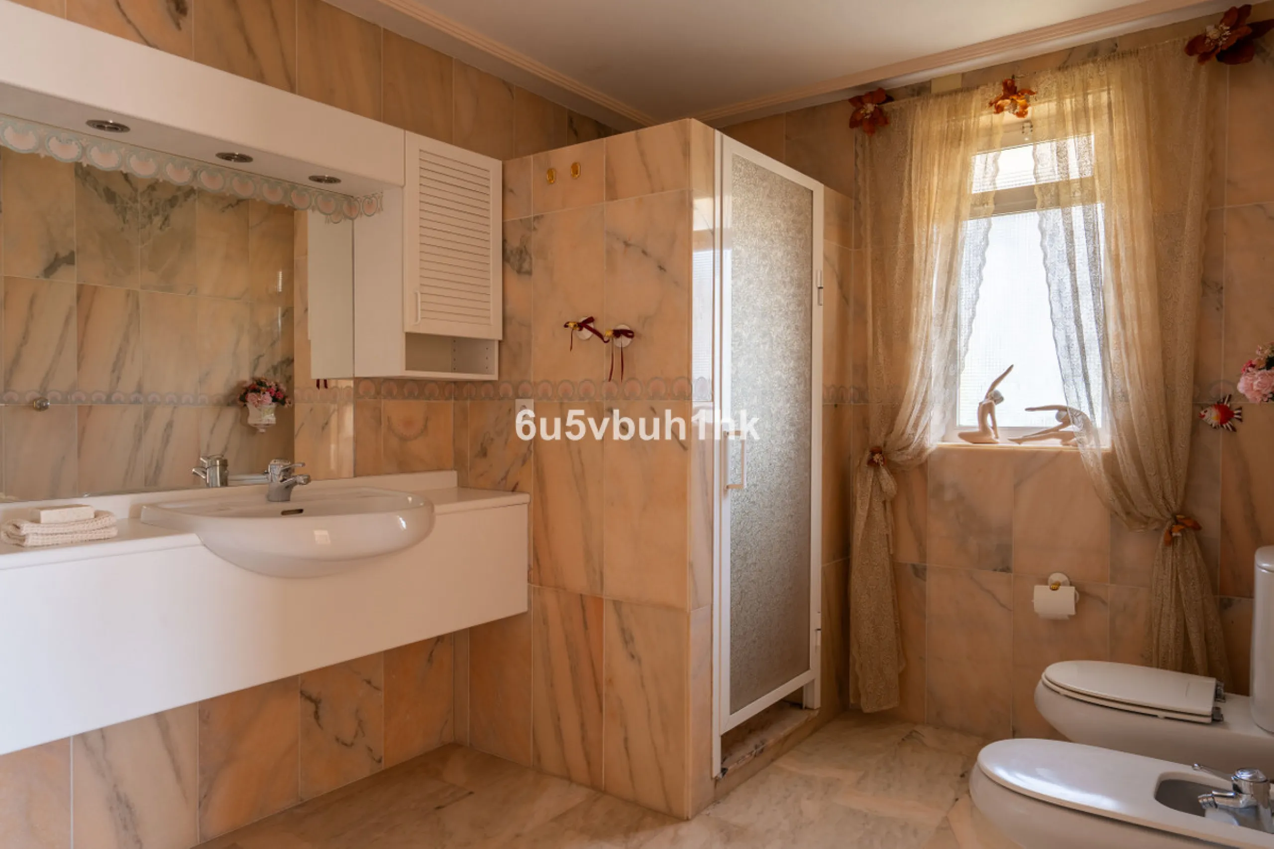 Hidden among palm trees and mature gardens in the established residential area of Sitio de Calahonda, this beautiful Andalusian villa captures the essence of traditional Mediterranean living. From the moment you arrive through the private gated entrance a