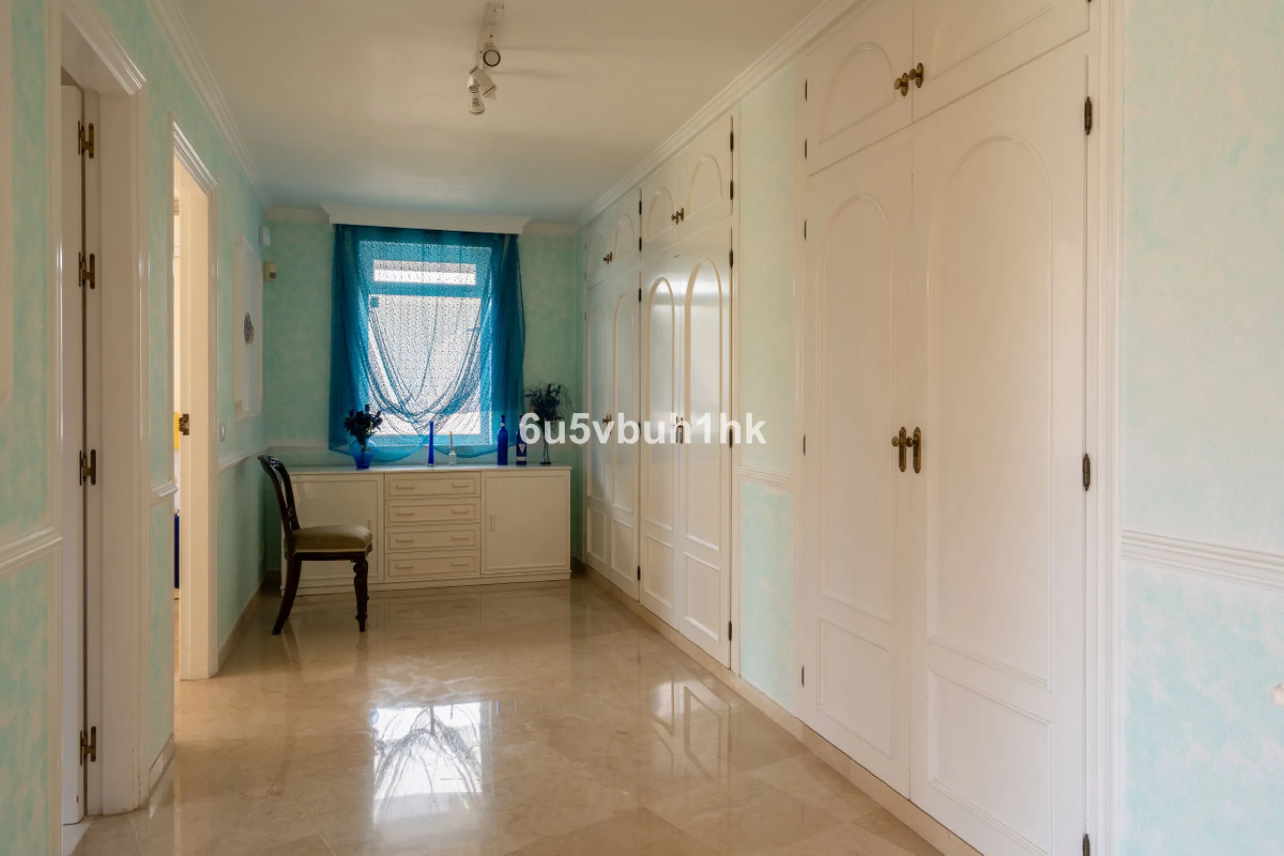 Hidden among palm trees and mature gardens in the established residential area of Sitio de Calahonda, this beautiful Andalusian villa captures the essence of traditional Mediterranean living. From the moment you arrive through the private gated entrance a