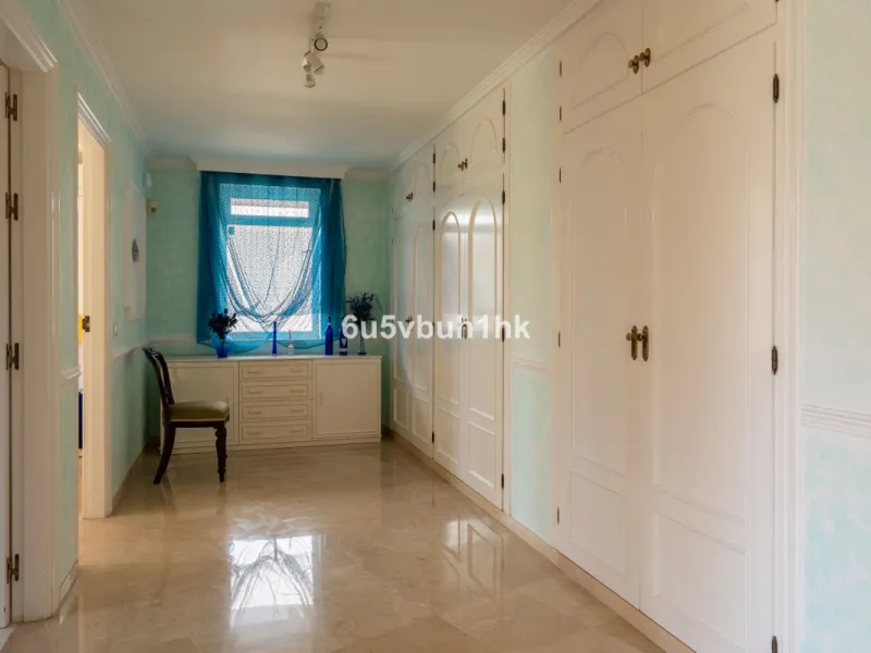 Hidden among palm trees and mature gardens in the established residential area of Sitio de Calahonda, this beautiful Andalusian villa captures the essence of traditional Mediterranean living. From the moment you arrive through the private gated entrance a