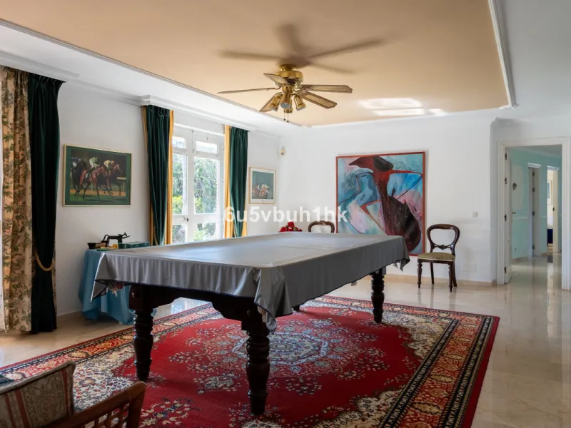 Hidden among palm trees and mature gardens in the established residential area of Sitio de Calahonda, this beautiful Andalusian villa captures the essence of traditional Mediterranean living. From the moment you arrive through the private gated entrance a
