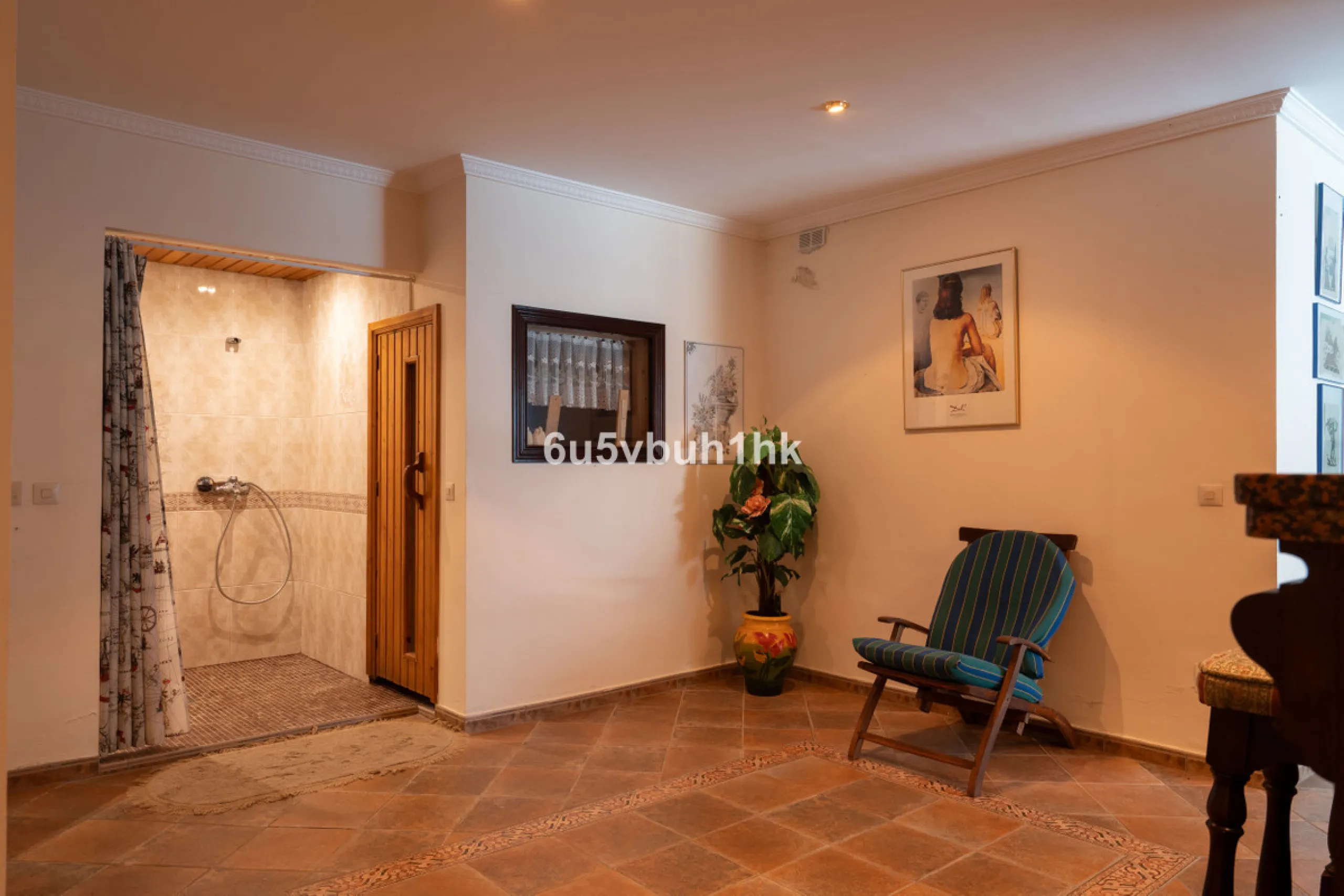 Hidden among palm trees and mature gardens in the established residential area of Sitio de Calahonda, this beautiful Andalusian villa captures the essence of traditional Mediterranean living. From the moment you arrive through the private gated entrance a