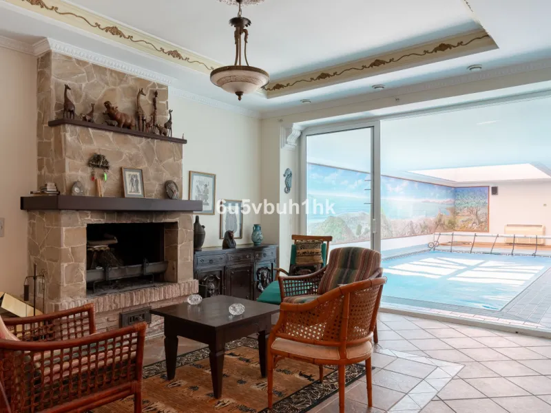 Hidden among palm trees and mature gardens in the established residential area of Sitio de Calahonda, this beautiful Andalusian villa captures the essence of traditional Mediterranean living. From the moment you arrive through the private gated entrance a