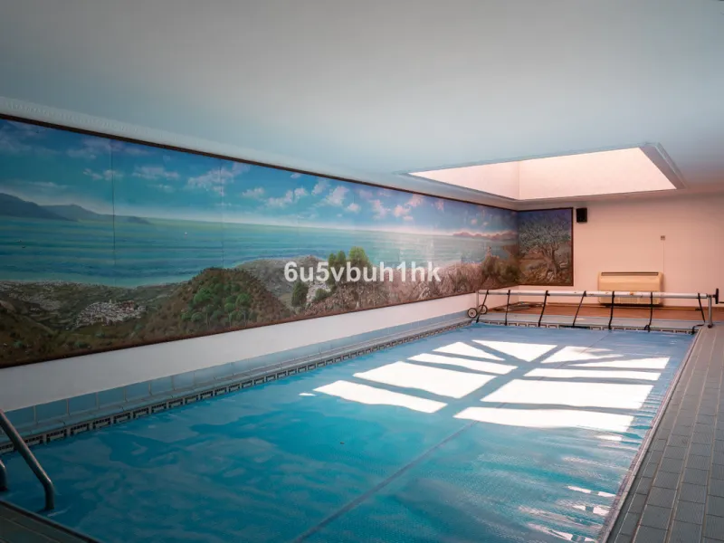 Hidden among palm trees and mature gardens in the established residential area of Sitio de Calahonda, this beautiful Andalusian villa captures the essence of traditional Mediterranean living. From the moment you arrive through the private gated entrance a
