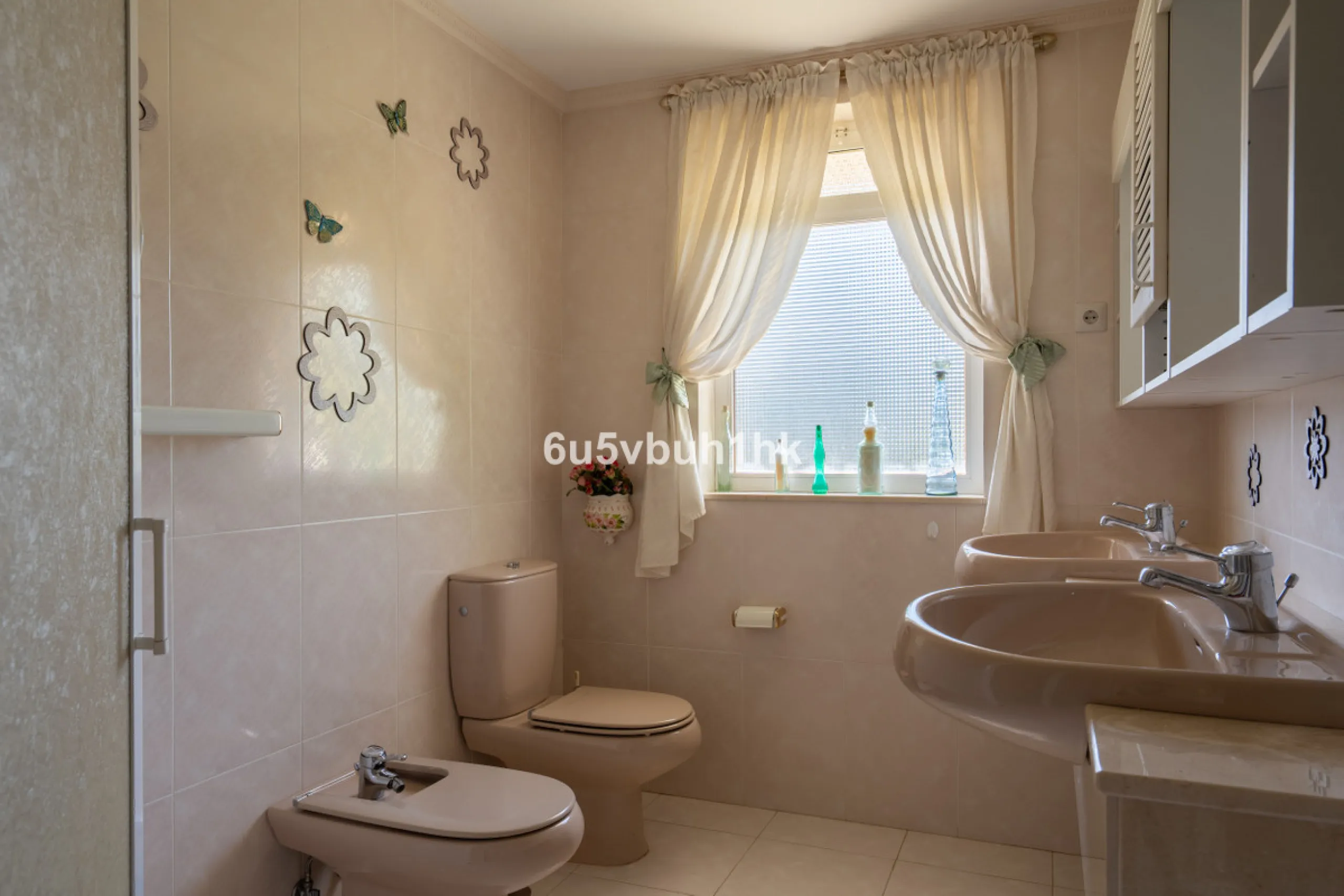 Hidden among palm trees and mature gardens in the established residential area of Sitio de Calahonda, this beautiful Andalusian villa captures the essence of traditional Mediterranean living. From the moment you arrive through the private gated entrance a