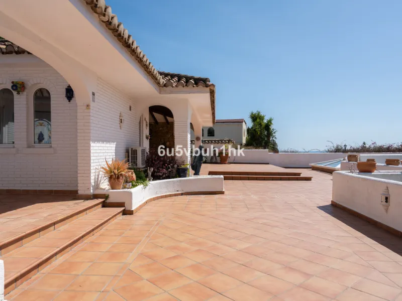 Hidden among palm trees and mature gardens in the established residential area of Sitio de Calahonda, this beautiful Andalusian villa captures the essence of traditional Mediterranean living. From the moment you arrive through the private gated entrance a
