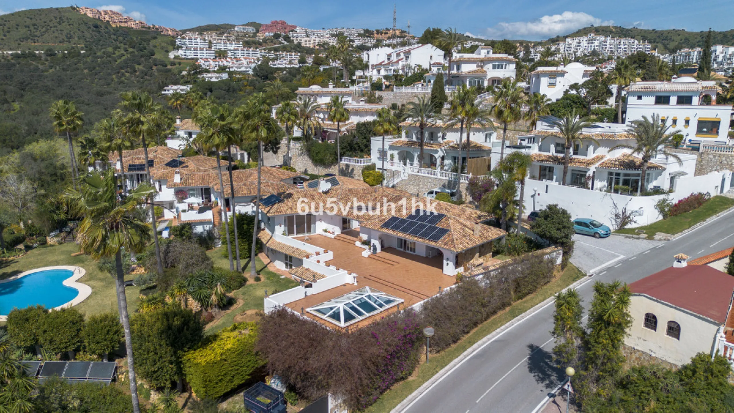Hidden among palm trees and mature gardens in the established residential area of Sitio de Calahonda, this beautiful Andalusian villa captures the essence of traditional Mediterranean living. From the moment you arrive through the private gated entrance a
