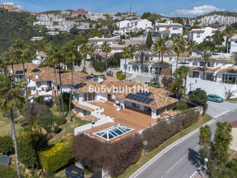 Hidden among palm trees and mature gardens in the established residential area of Sitio de Calahonda, this beautiful Andalusian villa captures the essence of traditional Mediterranean living. From the moment you arrive through the private gated entrance a