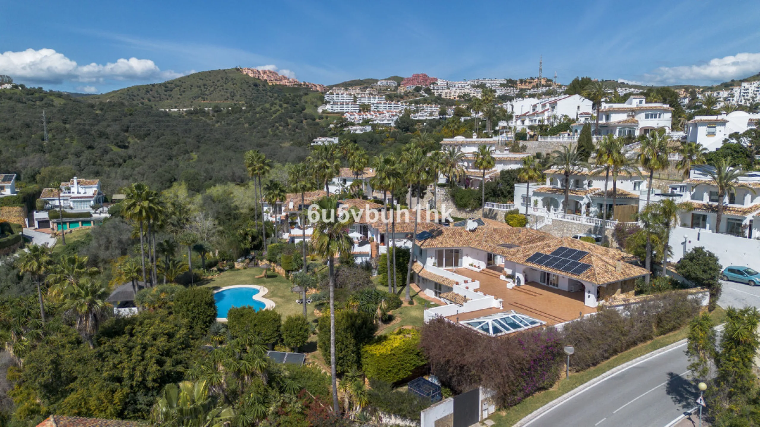 Hidden among palm trees and mature gardens in the established residential area of Sitio de Calahonda, this beautiful Andalusian villa captures the essence of traditional Mediterranean living. From the moment you arrive through the private gated entrance a