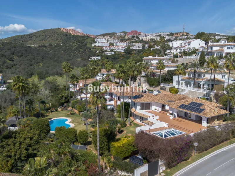 Hidden among palm trees and mature gardens in the established residential area of Sitio de Calahonda, this beautiful Andalusian villa captures the essence of traditional Mediterranean living. From the moment you arrive through the private gated entrance a