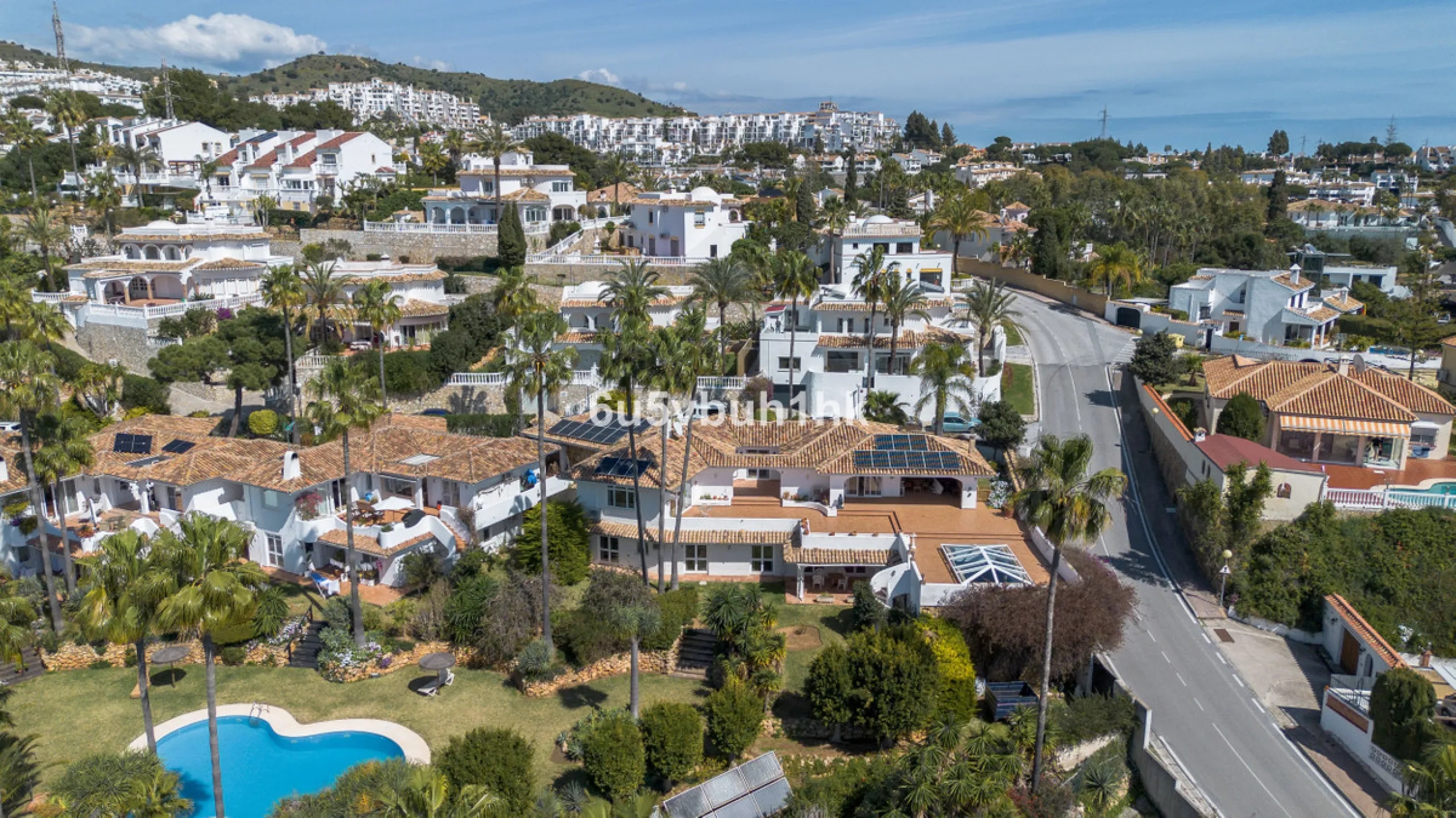 Hidden among palm trees and mature gardens in the established residential area of Sitio de Calahonda, this beautiful Andalusian villa captures the essence of traditional Mediterranean living. From the moment you arrive through the private gated entrance a