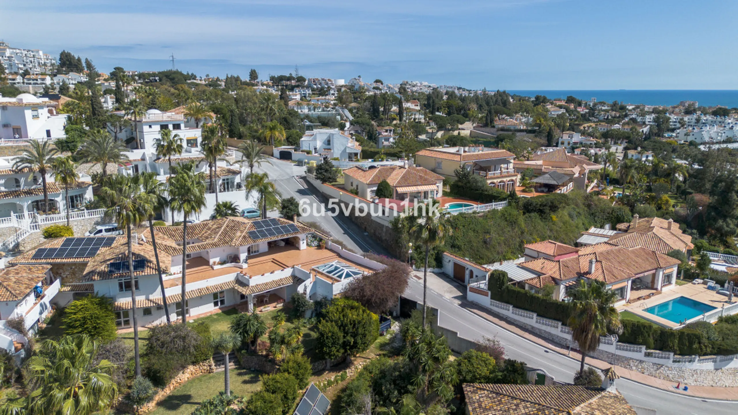 Hidden among palm trees and mature gardens in the established residential area of Sitio de Calahonda, this beautiful Andalusian villa captures the essence of traditional Mediterranean living. From the moment you arrive through the private gated entrance a