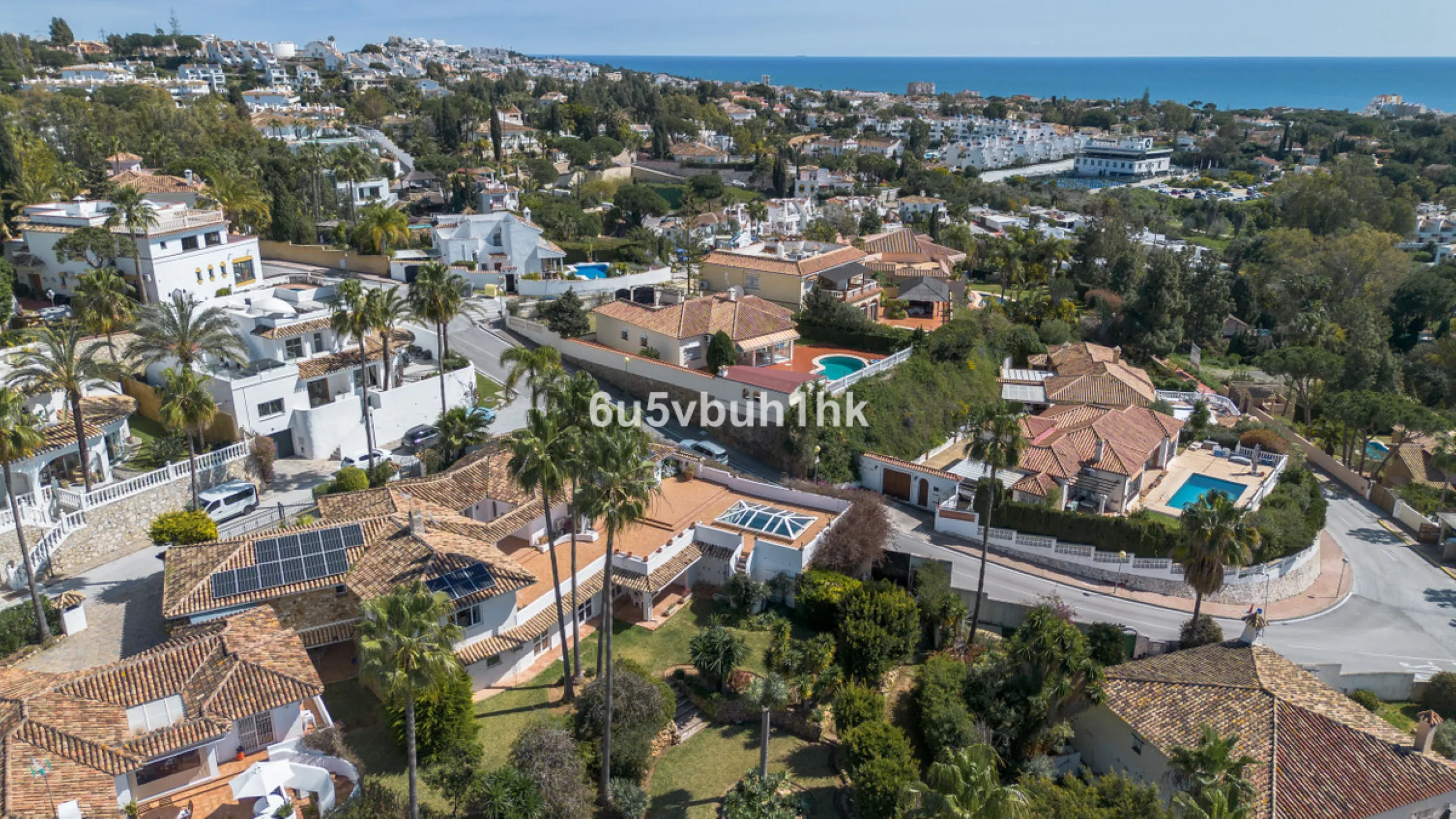 Hidden among palm trees and mature gardens in the established residential area of Sitio de Calahonda, this beautiful Andalusian villa captures the essence of traditional Mediterranean living. From the moment you arrive through the private gated entrance a