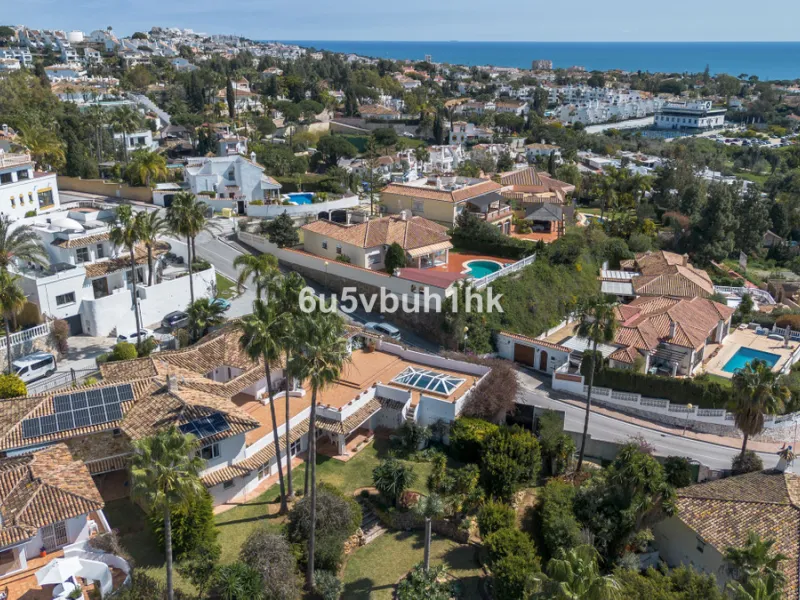 Hidden among palm trees and mature gardens in the established residential area of Sitio de Calahonda, this beautiful Andalusian villa captures the essence of traditional Mediterranean living. From the moment you arrive through the private gated entrance a