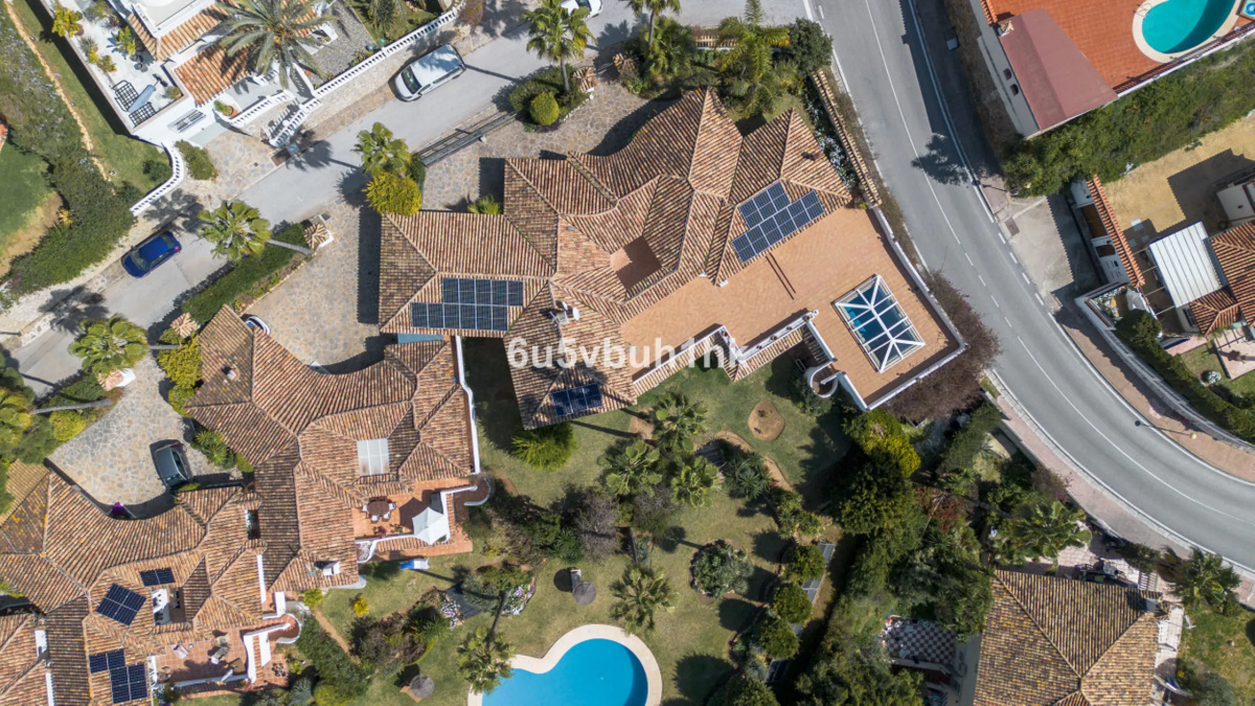Hidden among palm trees and mature gardens in the established residential area of Sitio de Calahonda, this beautiful Andalusian villa captures the essence of traditional Mediterranean living. From the moment you arrive through the private gated entrance a