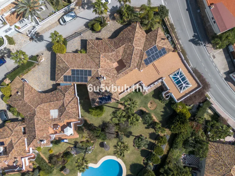 Hidden among palm trees and mature gardens in the established residential area of Sitio de Calahonda, this beautiful Andalusian villa captures the essence of traditional Mediterranean living. From the moment you arrive through the private gated entrance a