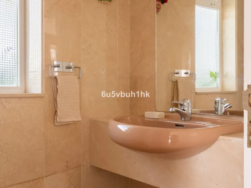 Hidden among palm trees and mature gardens in the established residential area of Sitio de Calahonda, this beautiful Andalusian villa captures the essence of traditional Mediterranean living. From the moment you arrive through the private gated entrance a