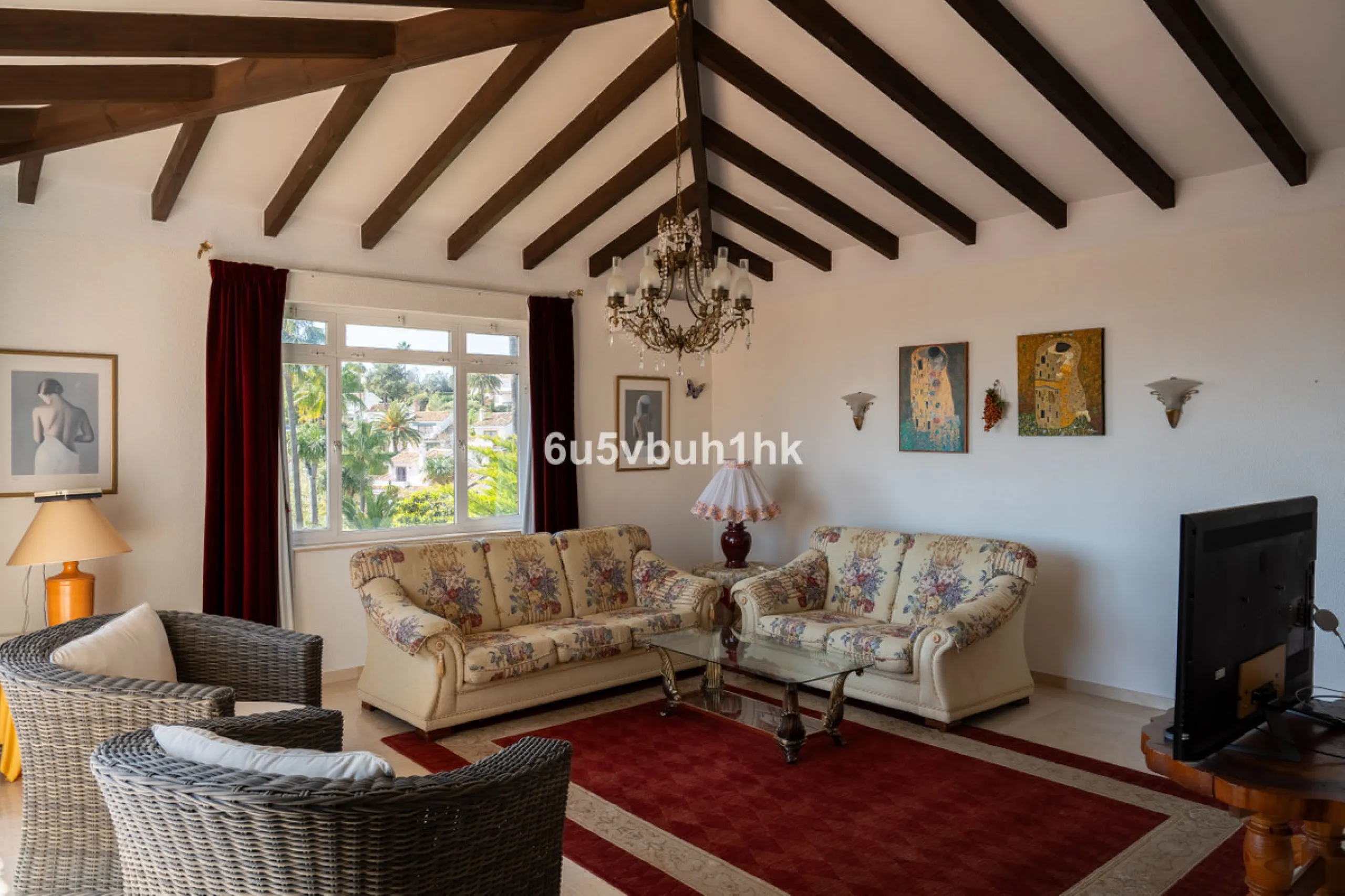 Hidden among palm trees and mature gardens in the established residential area of Sitio de Calahonda, this beautiful Andalusian villa captures the essence of traditional Mediterranean living. From the moment you arrive through the private gated entrance a