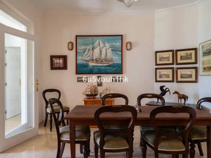 Hidden among palm trees and mature gardens in the established residential area of Sitio de Calahonda, this beautiful Andalusian villa captures the essence of traditional Mediterranean living. From the moment you arrive through the private gated entrance a