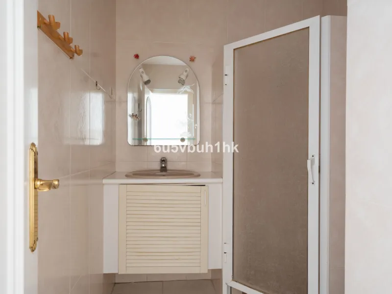 Hidden among palm trees and mature gardens in the established residential area of Sitio de Calahonda, this beautiful Andalusian villa captures the essence of traditional Mediterranean living. From the moment you arrive through the private gated entrance a