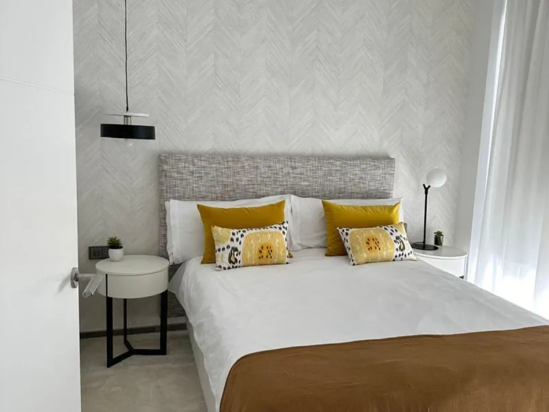 This stylish semi-detached villa is located in an exclusive gated community just a short walk from the beach and only minutes away from Puerto Banús.