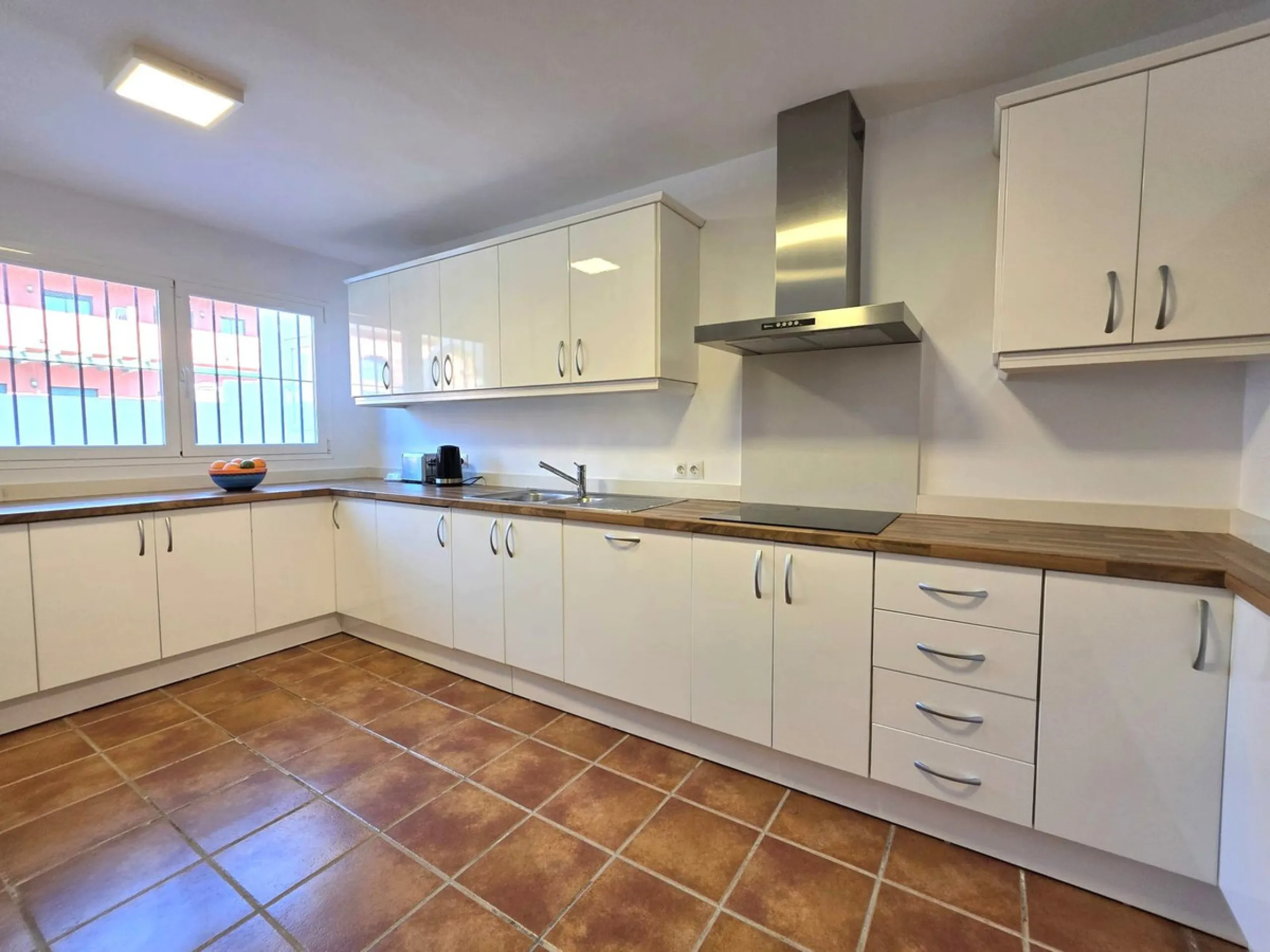 This beautiful 3 bed townhouse is located in a fantastic area, walking distance to all amenities and the beach. The house is Andalucian in style, built over 3 levels and sold fully furnished. On the ground level you are greeted by an entrance hall and lar