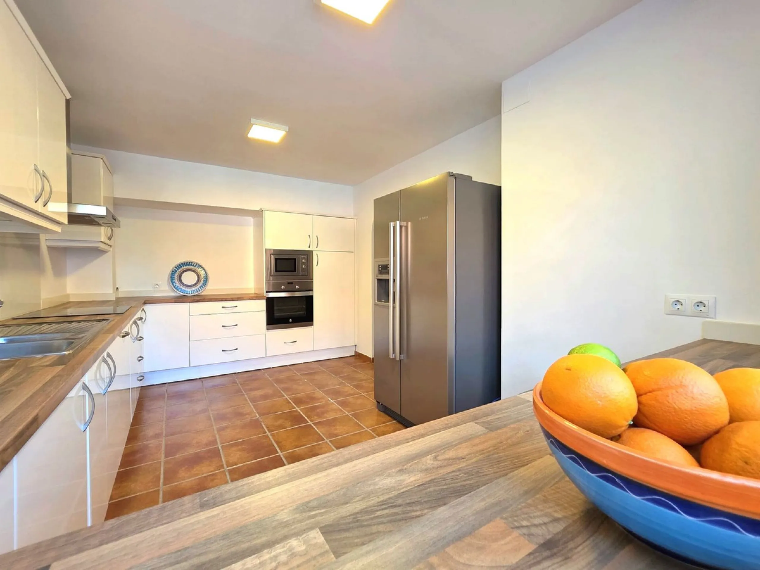 This beautiful 3 bed townhouse is located in a fantastic area, walking distance to all amenities and the beach. The house is Andalucian in style, built over 3 levels and sold fully furnished. On the ground level you are greeted by an entrance hall and lar