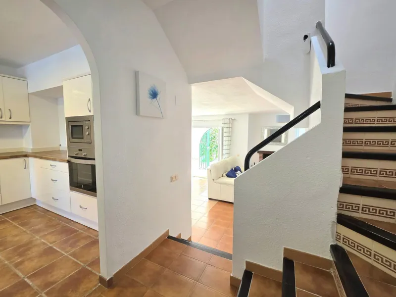 This beautiful 3 bed townhouse is located in a fantastic area, walking distance to all amenities and the beach. The house is Andalucian in style, built over 3 levels and sold fully furnished. On the ground level you are greeted by an entrance hall and lar
