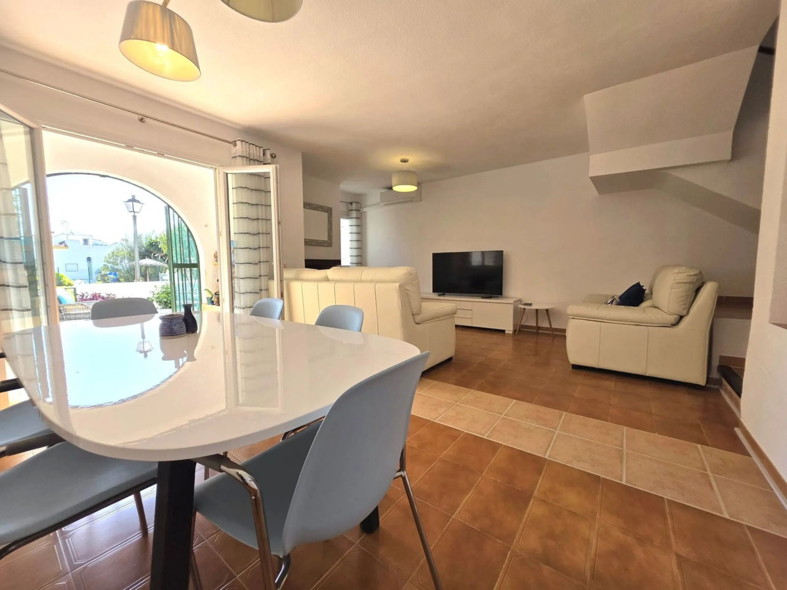 This beautiful 3 bed townhouse is located in a fantastic area, walking distance to all amenities and the beach. The house is Andalucian in style, built over 3 levels and sold fully furnished. On the ground level you are greeted by an entrance hall and lar